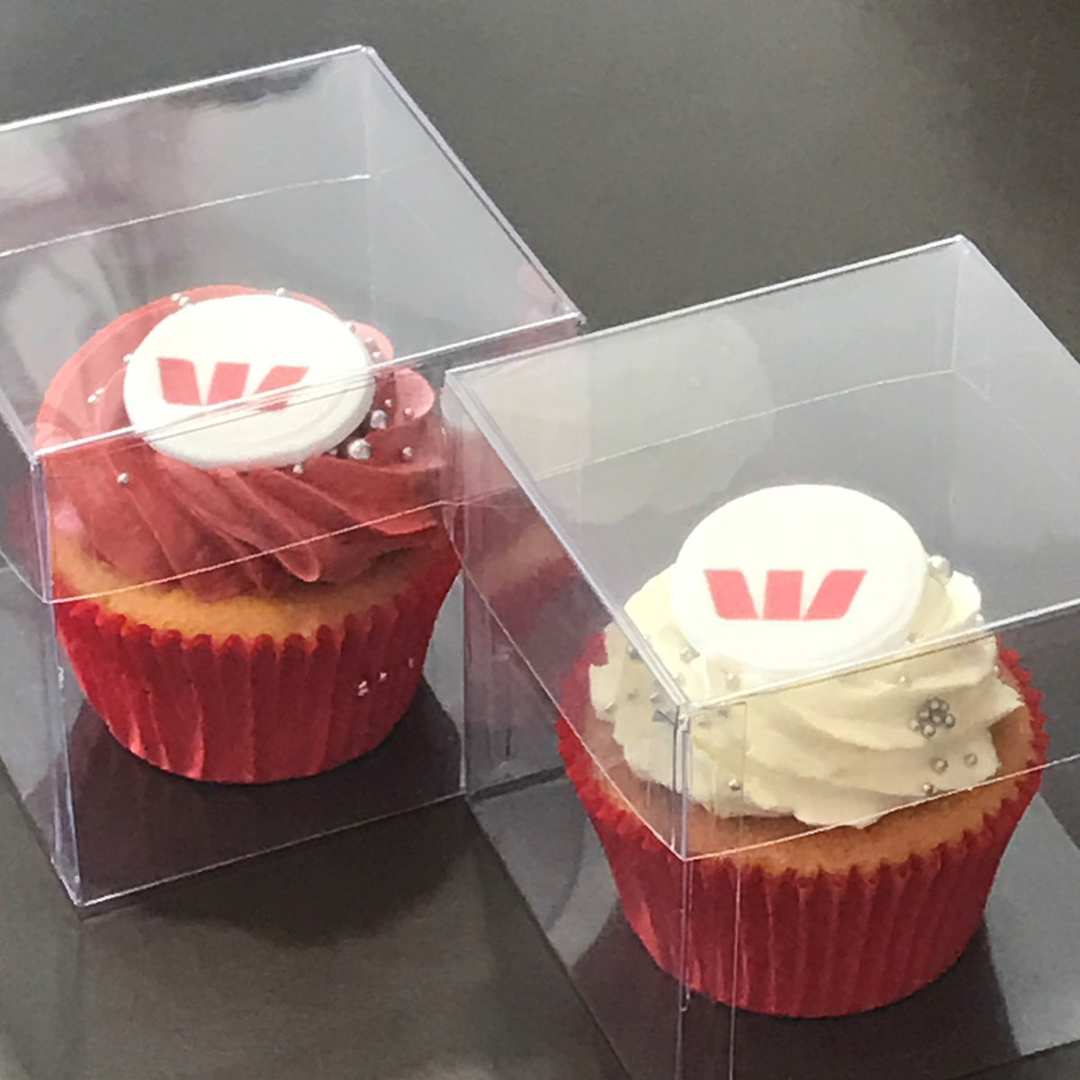 Individual boxed cupcakes with logos The Cupcake Factory