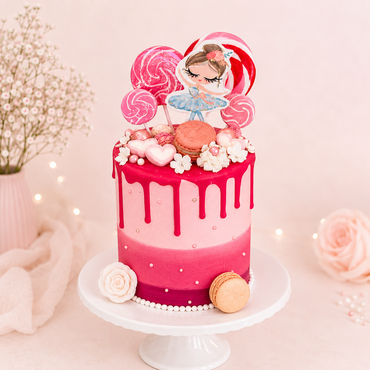 Pink cake with decorative elements on a white stand against a soft pink background