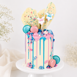 Colorful cake with pastel decorations on a white background