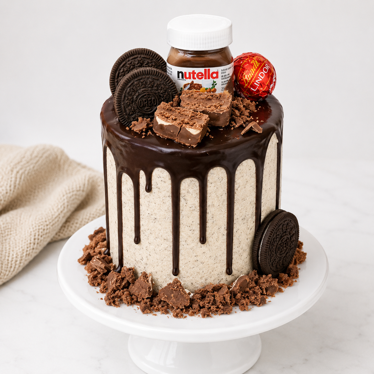 Chocolate cake with Nutella, Oreo cookies, and a Ferrero Rocher on a white background